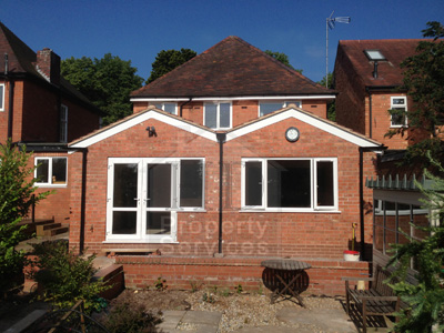 Single storey extension with double pitched roof photo 1