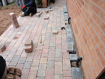 The block paving laying pattern worked around existing drainage