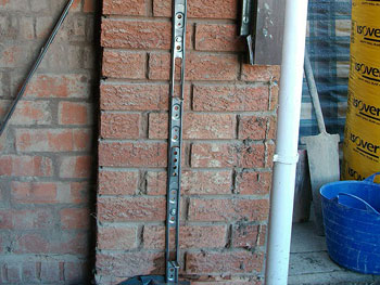 The new wall is securely tied in to the existing brickwork