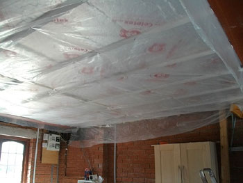 Floor insulation seen from the garage below