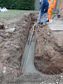 Concrete begins to flow into the trench