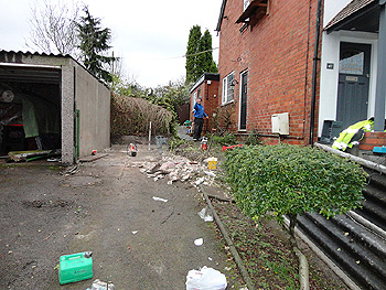 the original side path and garage space after demolition