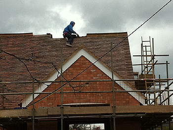 Our roofer works on the ridge tiles