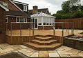Large Decking Area With Feature Steps and Stone Patio Paving 1